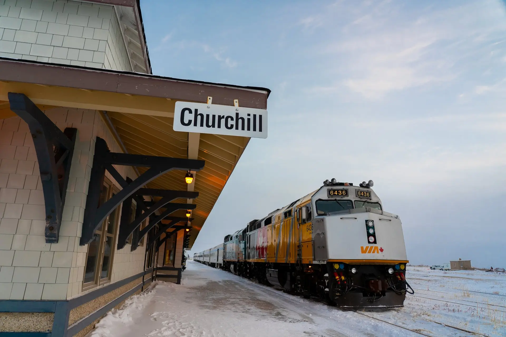 via rail train at station in churchill with snow on the ground